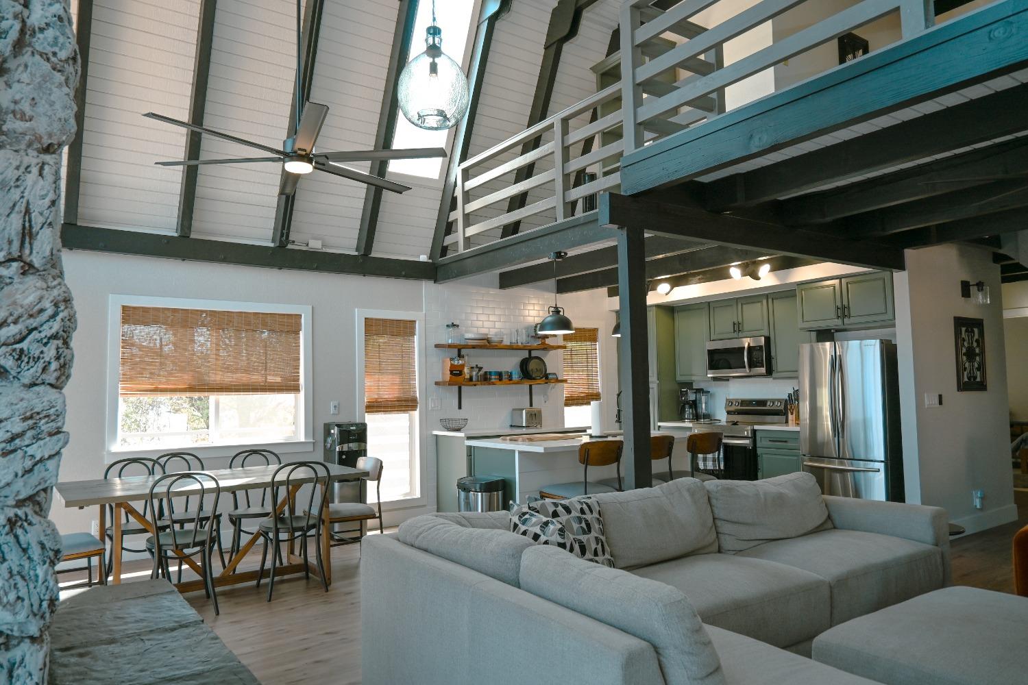 a living room with furniture wooden floor and a table