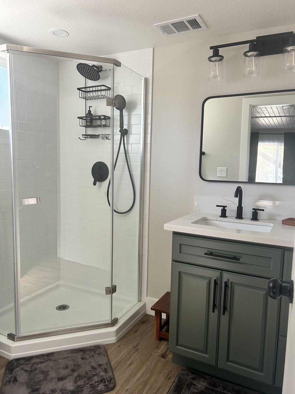 4220 Tomahawk Trail Copperopolis, CA 95228 - Photo 10 of 16 a bathroom with a granite countertop sink a mirror and shower