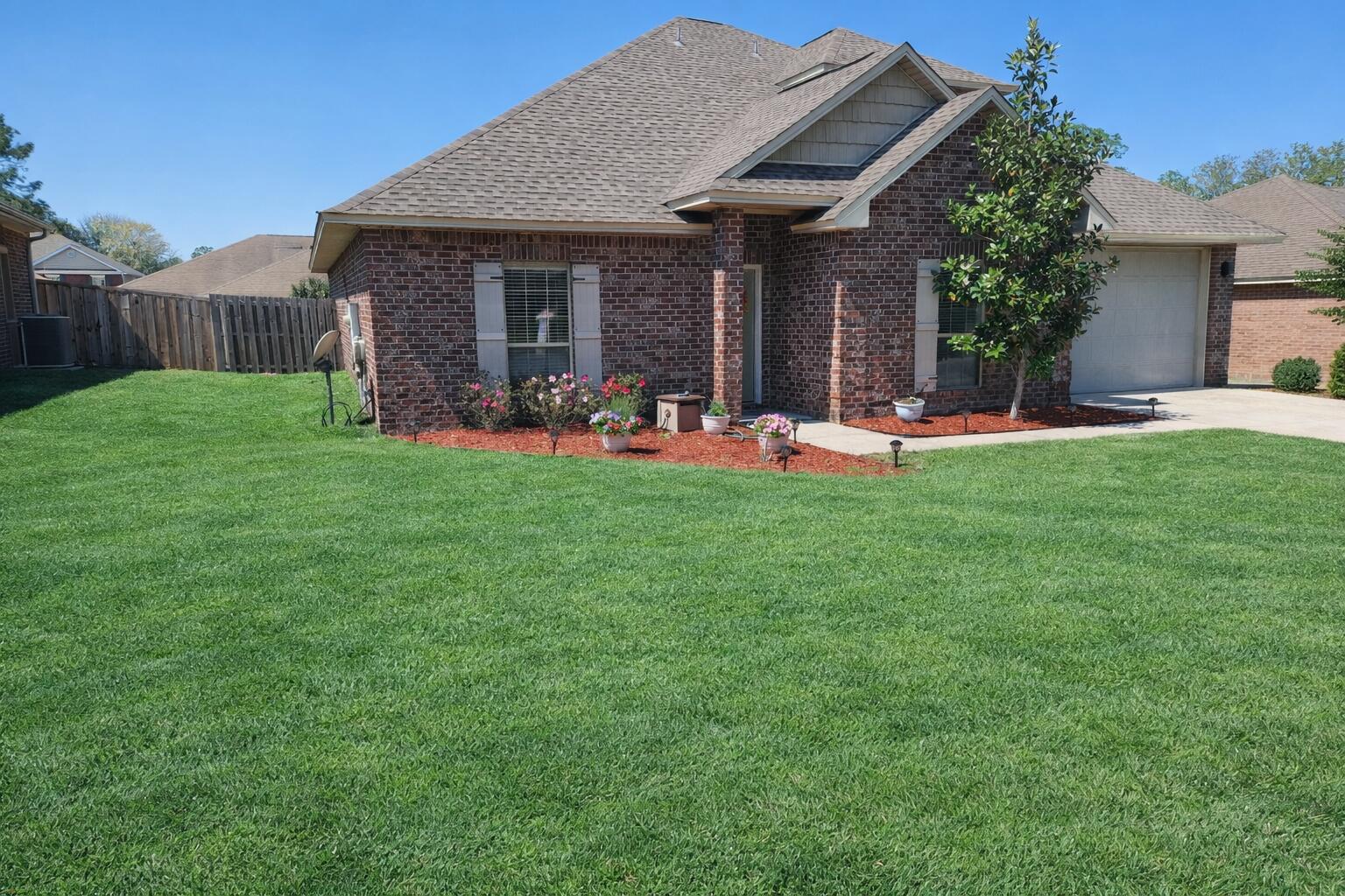 4627 Hermosa Road Crestview, FL 32539 - Photo 1 of 40 a view of a house with backyard porch and sitting area