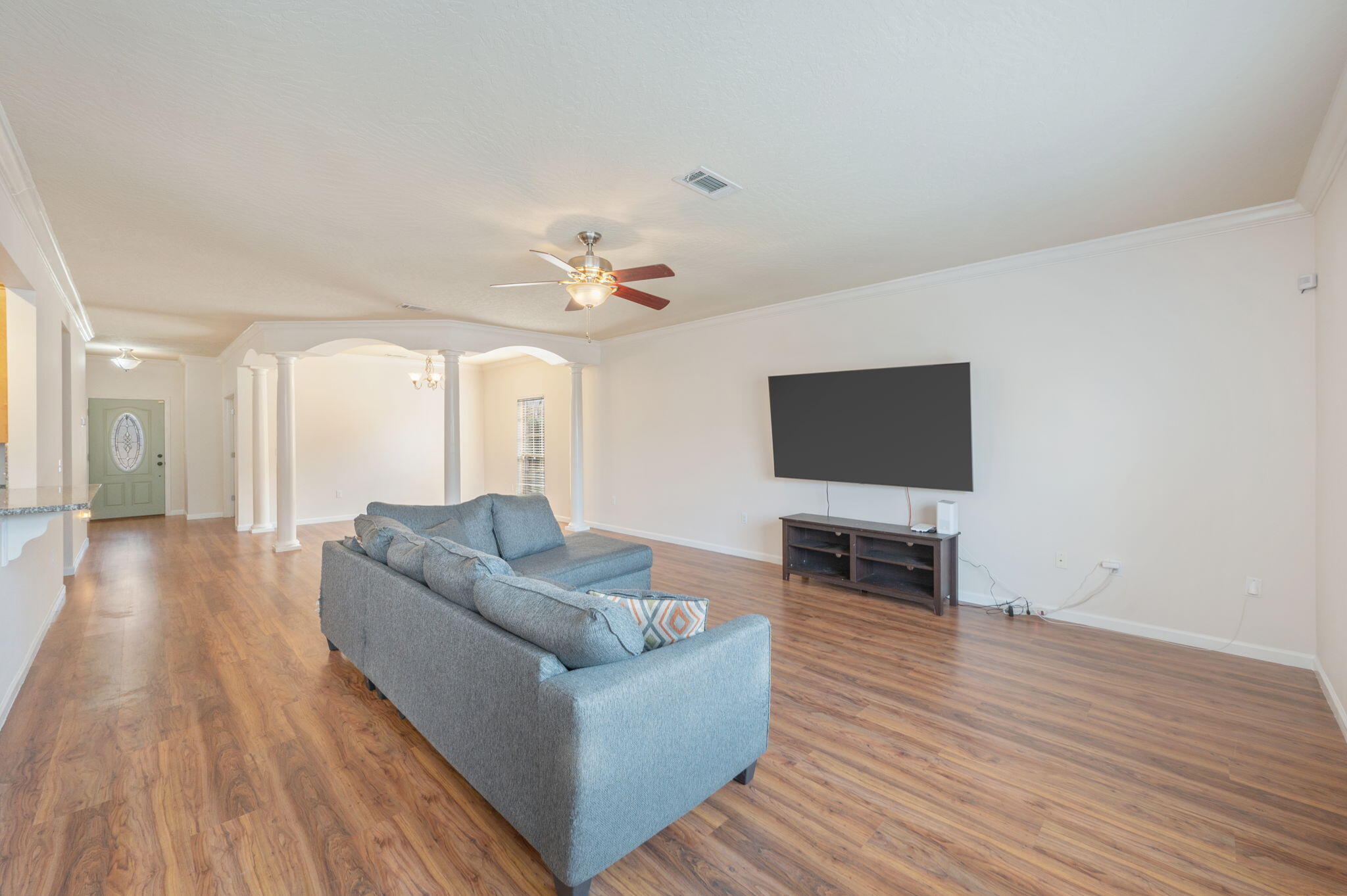4627 Hermosa Road Crestview, FL 32539 - Photo 12 of 40 a living room with furniture and a flat screen tv