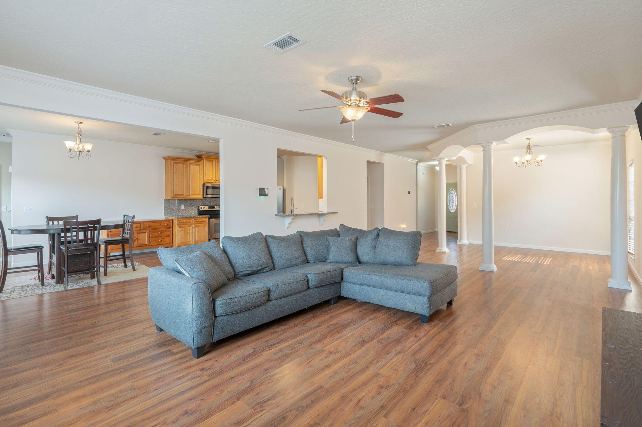 4627 Hermosa Road Crestview, FL 32539 - Photo 13 of 40 a living room with furniture and a wooden floor