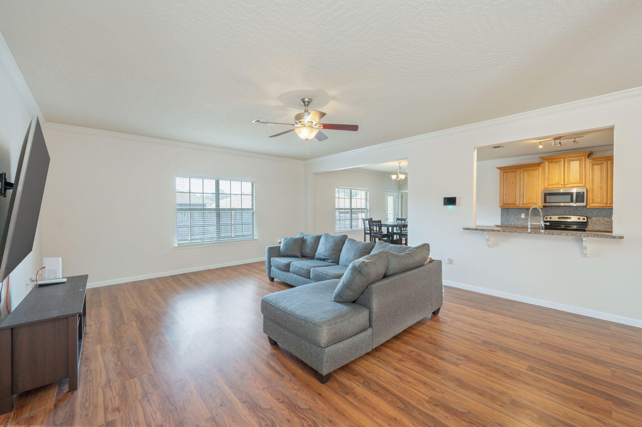 4627 Hermosa Road Crestview, FL 32539 - Photo 14 of 40 a living room with furniture and a flat screen tv