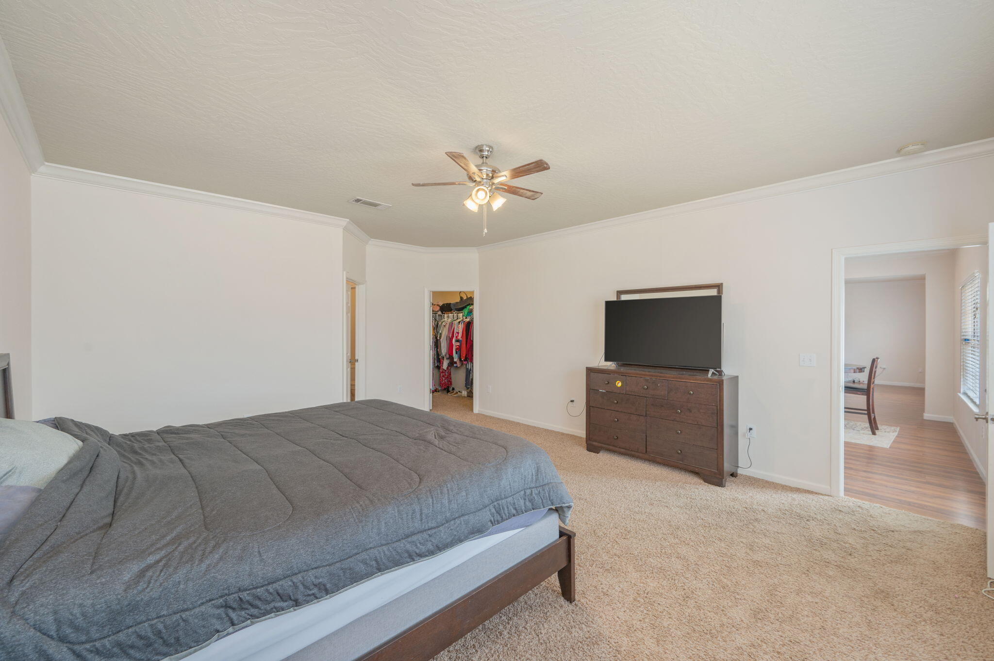4627 Hermosa Road Crestview, FL 32539 - Photo 21 of 40 a spacious bedroom with a bed and a flat screen tv
