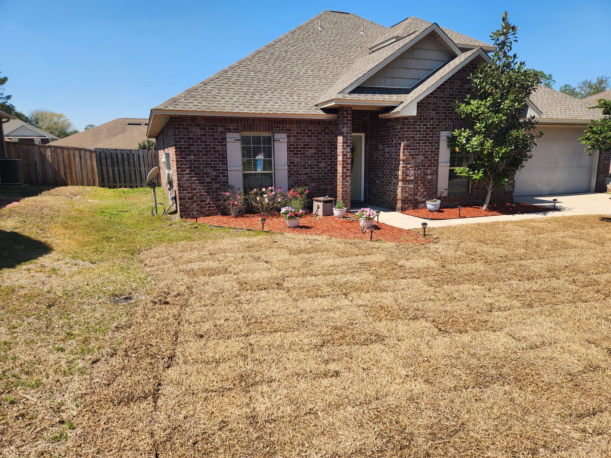 4627 Hermosa Road Crestview, FL 32539 - Photo 3 of 40 a view of a house with backyard and porch
