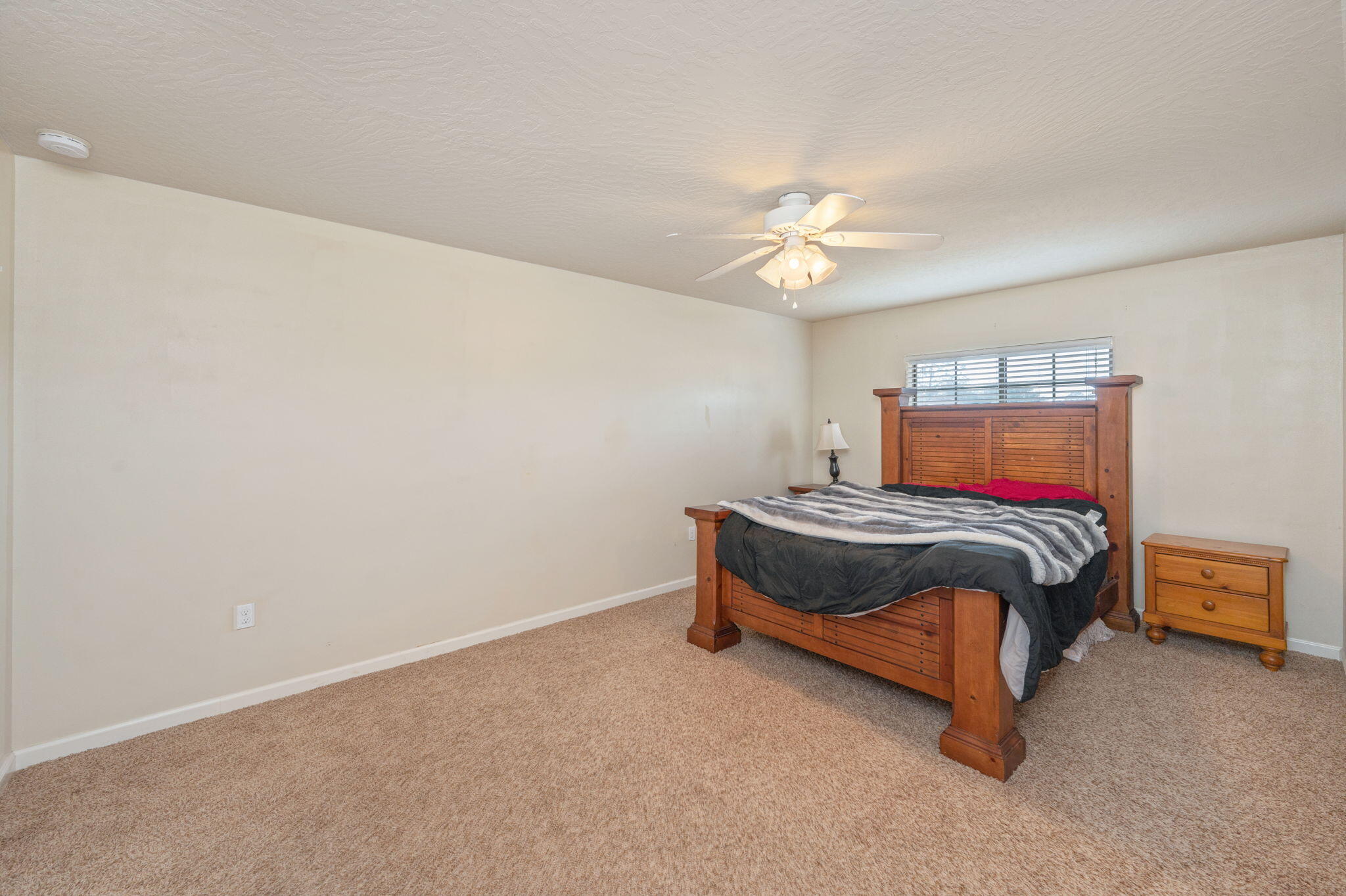 4627 Hermosa Road Crestview, FL 32539 - Photo 31 of 40 a bedroom with a bed and a chandelier