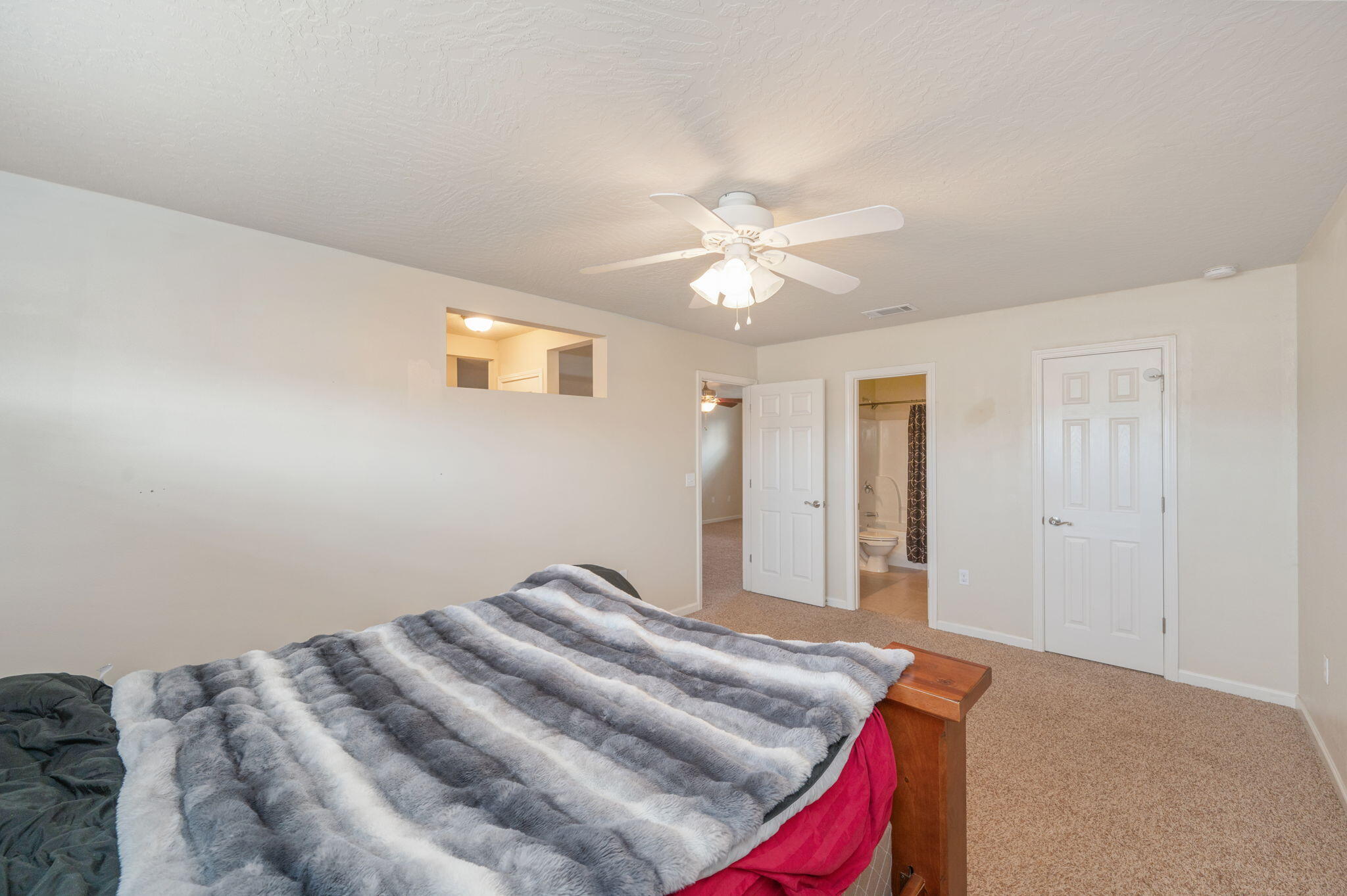 4627 Hermosa Road Crestview, FL 32539 - Photo 32 of 40 a bedroom with a bed and a chandelier