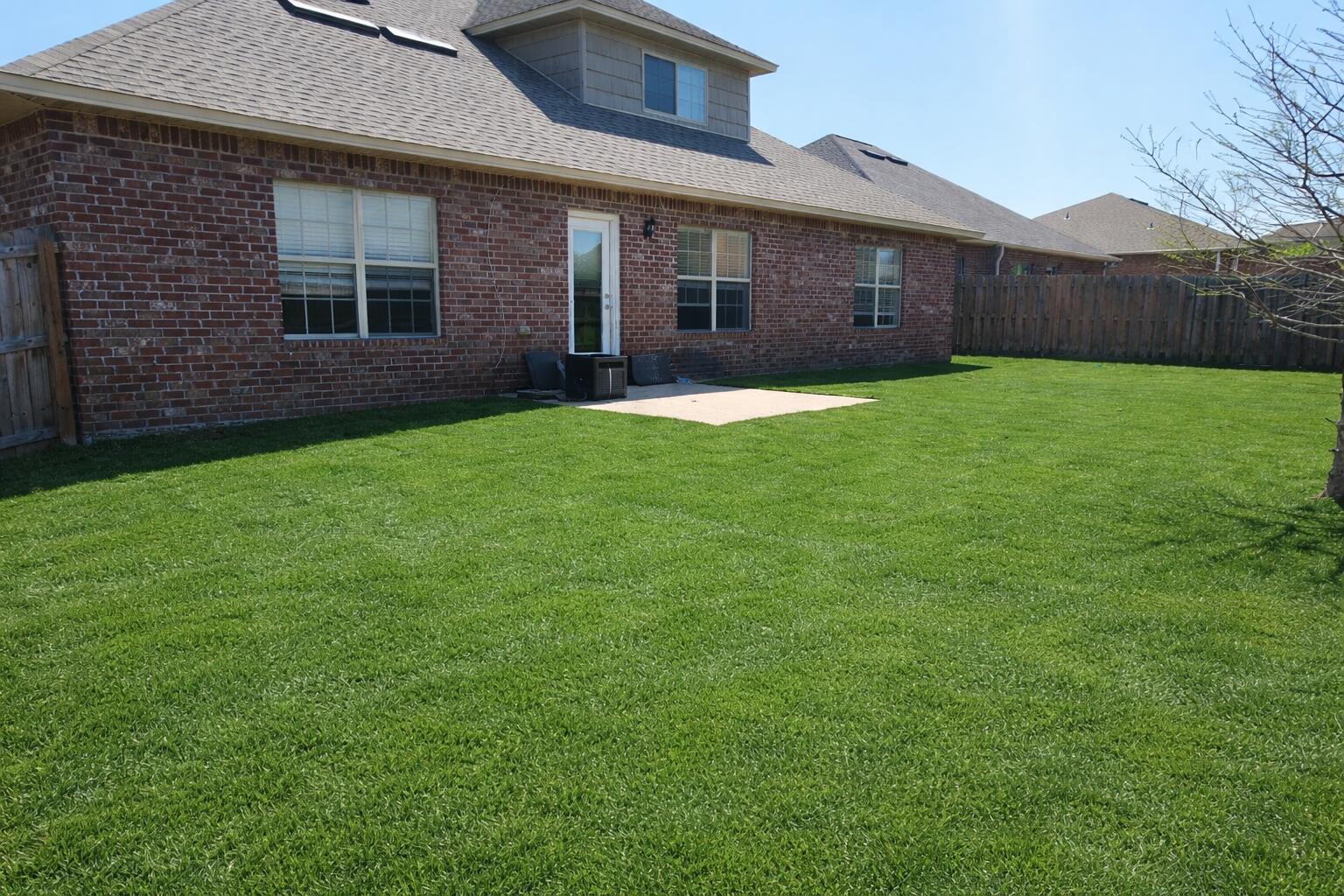 4627 Hermosa Road Crestview, FL 32539 - Photo 35 of 40 a front view of a house with a garden and yard