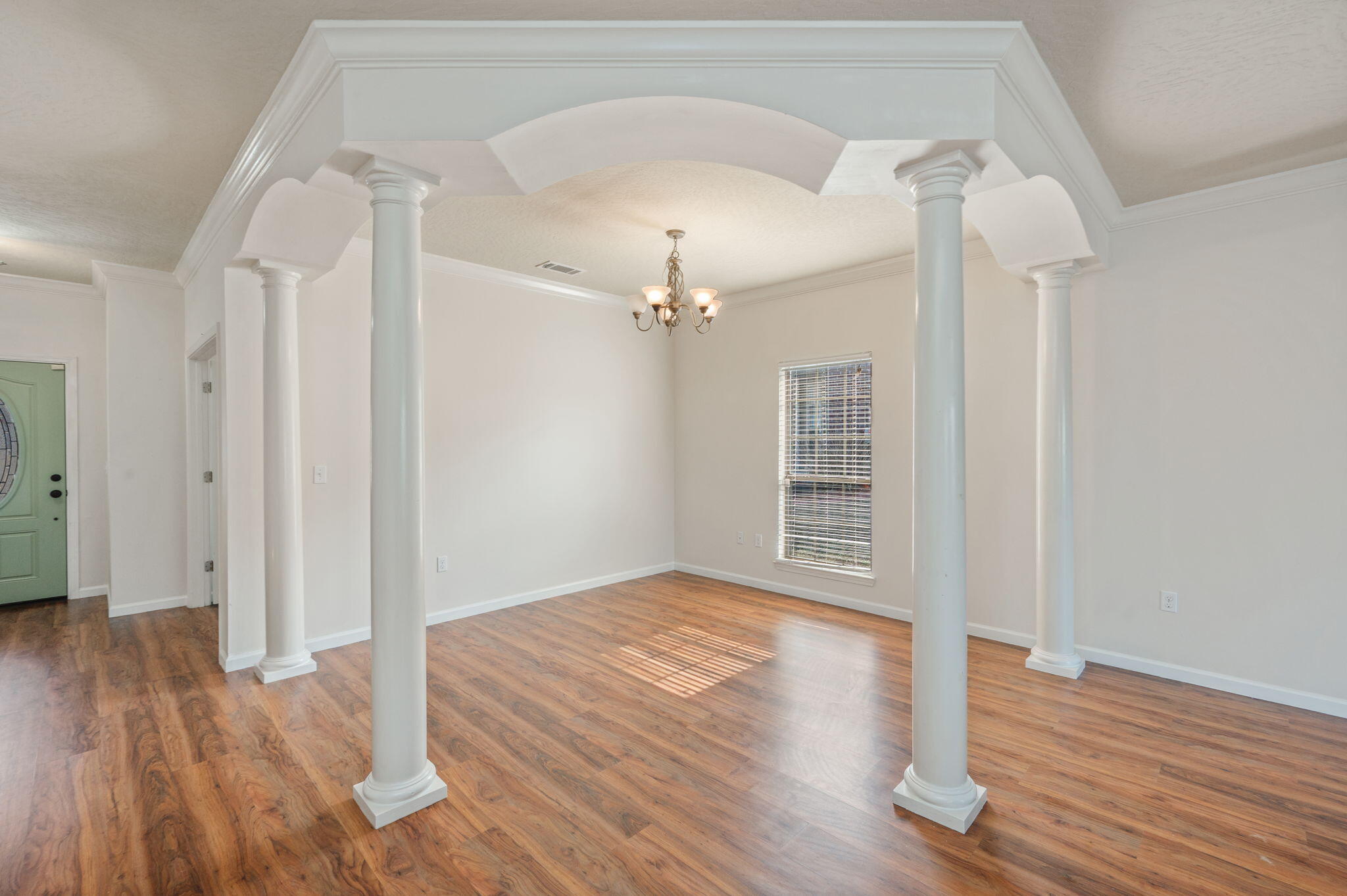 4627 Hermosa Road Crestview, FL 32539 - Photo 10 of 40 wooden floor in an empty room with a window
