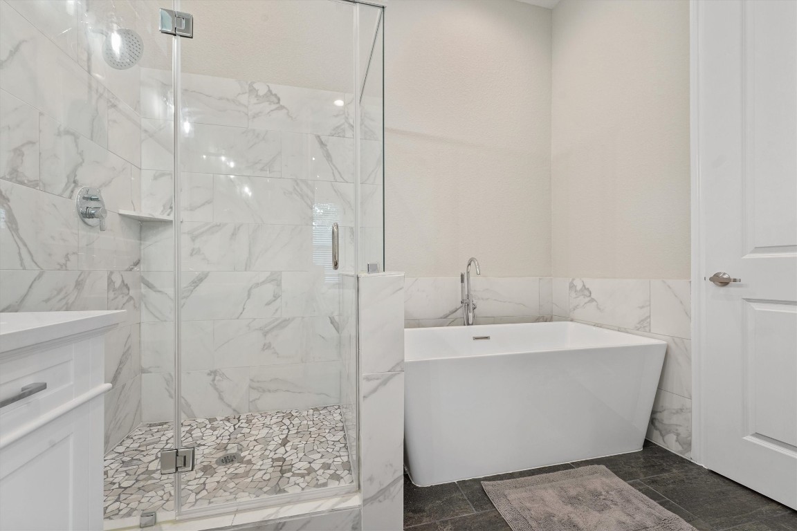 5620 Madison Street Houston, TX 77091 - Photo 11 of 17 a bathroom with a bathtub and shower