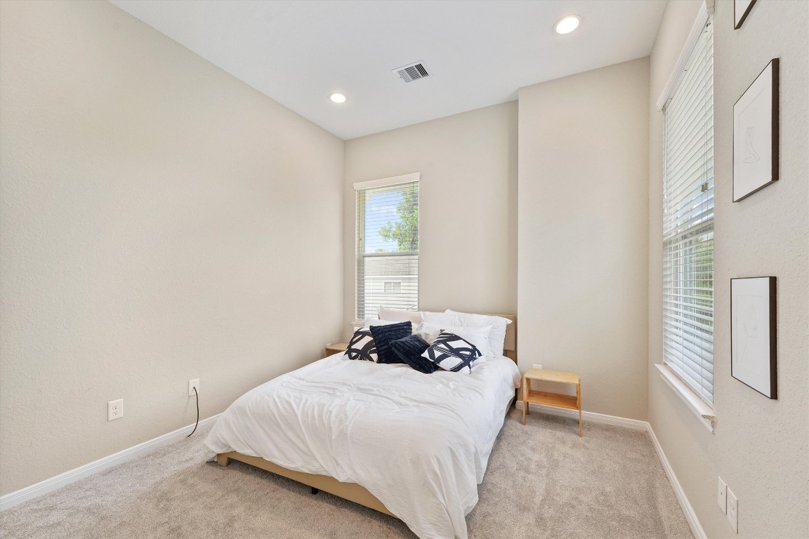 5620 Madison Street Houston, TX 77091 - Photo 13 of 17 a bedroom with a bed and a window