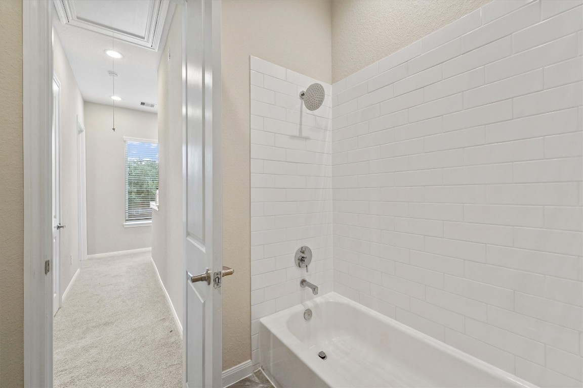 5620 Madison Street Houston, TX 77091 - Photo 16 of 17 a bathroom with a bathtub and a shower