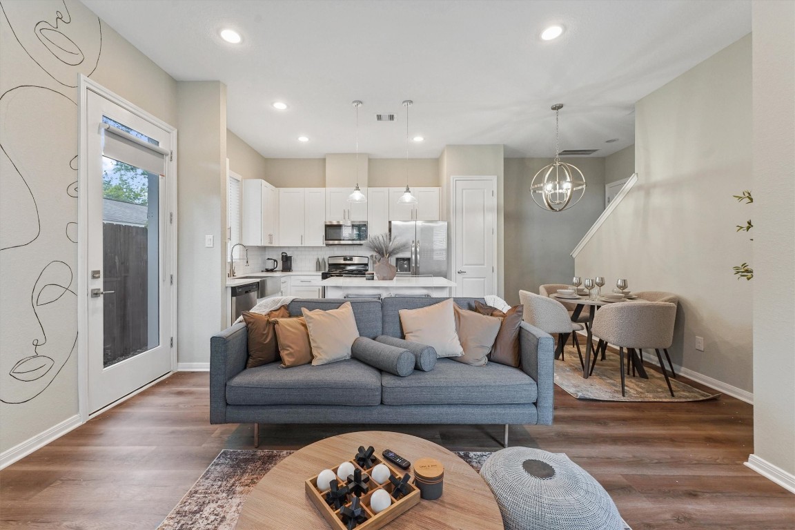 5620 Madison Street Houston, TX 77091 - Photo 4 of 17 a living room with furniture and a dining table with kitchen view