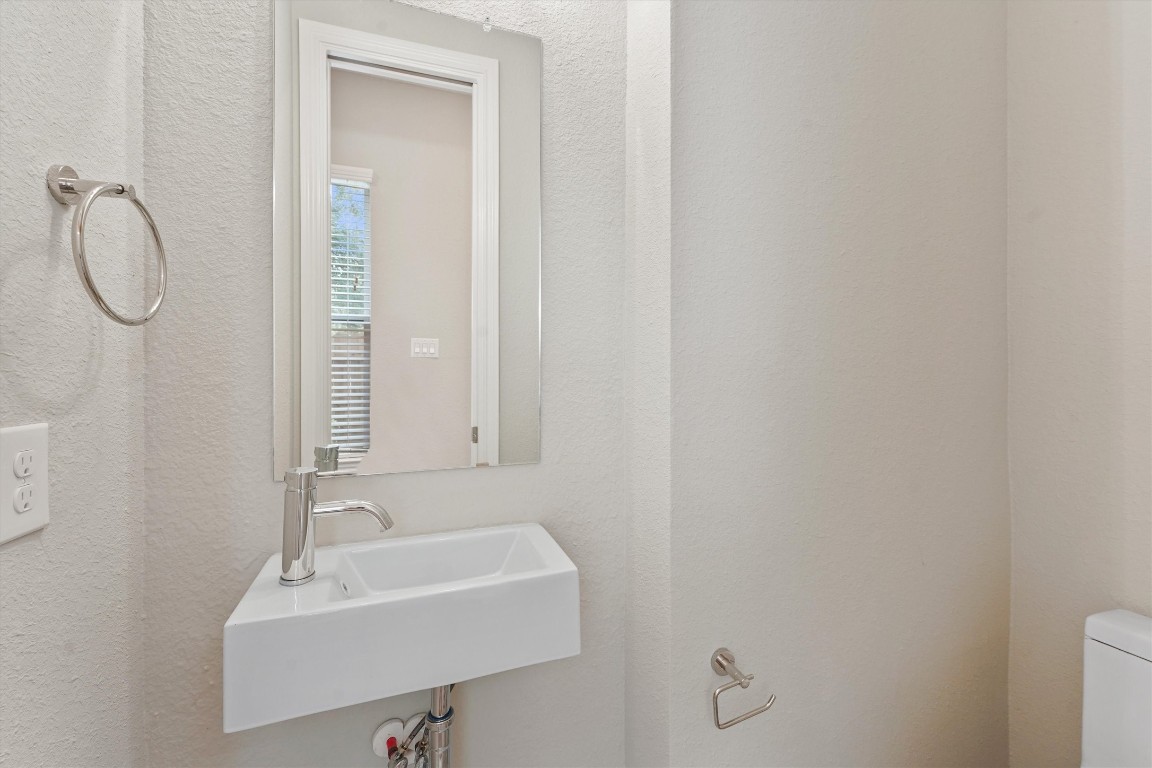 5620 Madison Street Houston, TX 77091 - Photo 8 of 17 a bathroom with a sink and a mirror