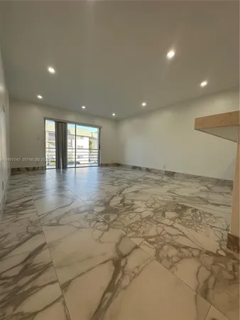 a view of a hall with an entryway