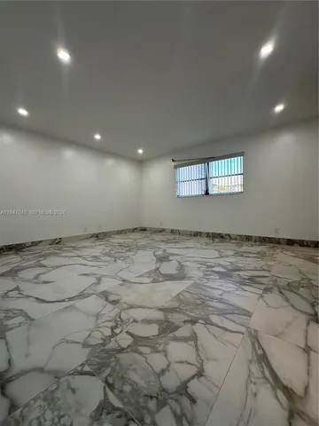 a bathroom with a sink vanity and a mirror