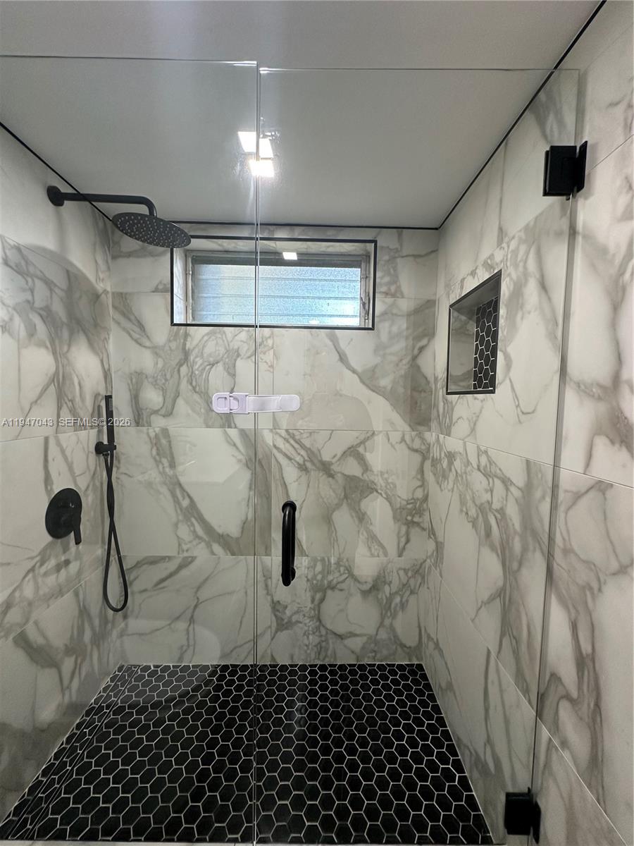 4100 North 58th Avenue, Unit 211 Hollywood, FL 33021 - Photo 24 of 47 a bathroom with a shower