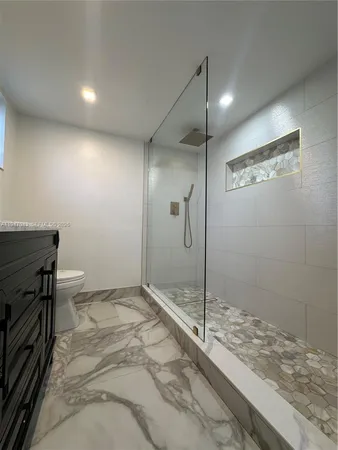 a bathroom with a sink vanity and a mirror