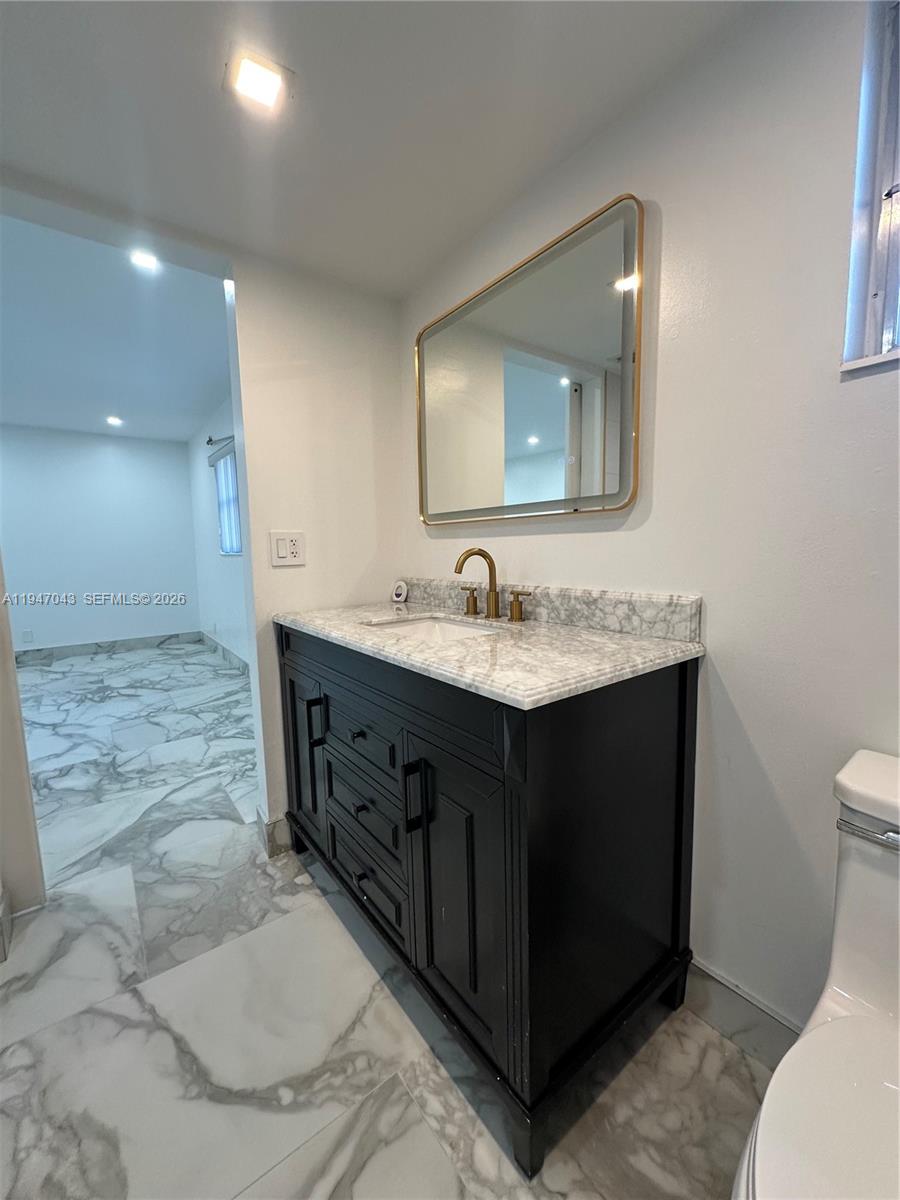4100 North 58th Avenue, Unit 211 Hollywood, FL 33021 - Photo 27 of 47 a bathroom with a sink vanity and a mirror