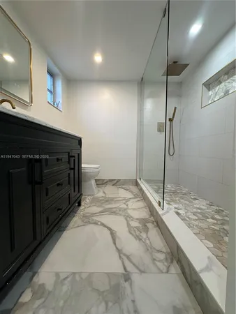 a bathroom with a shower and a sink