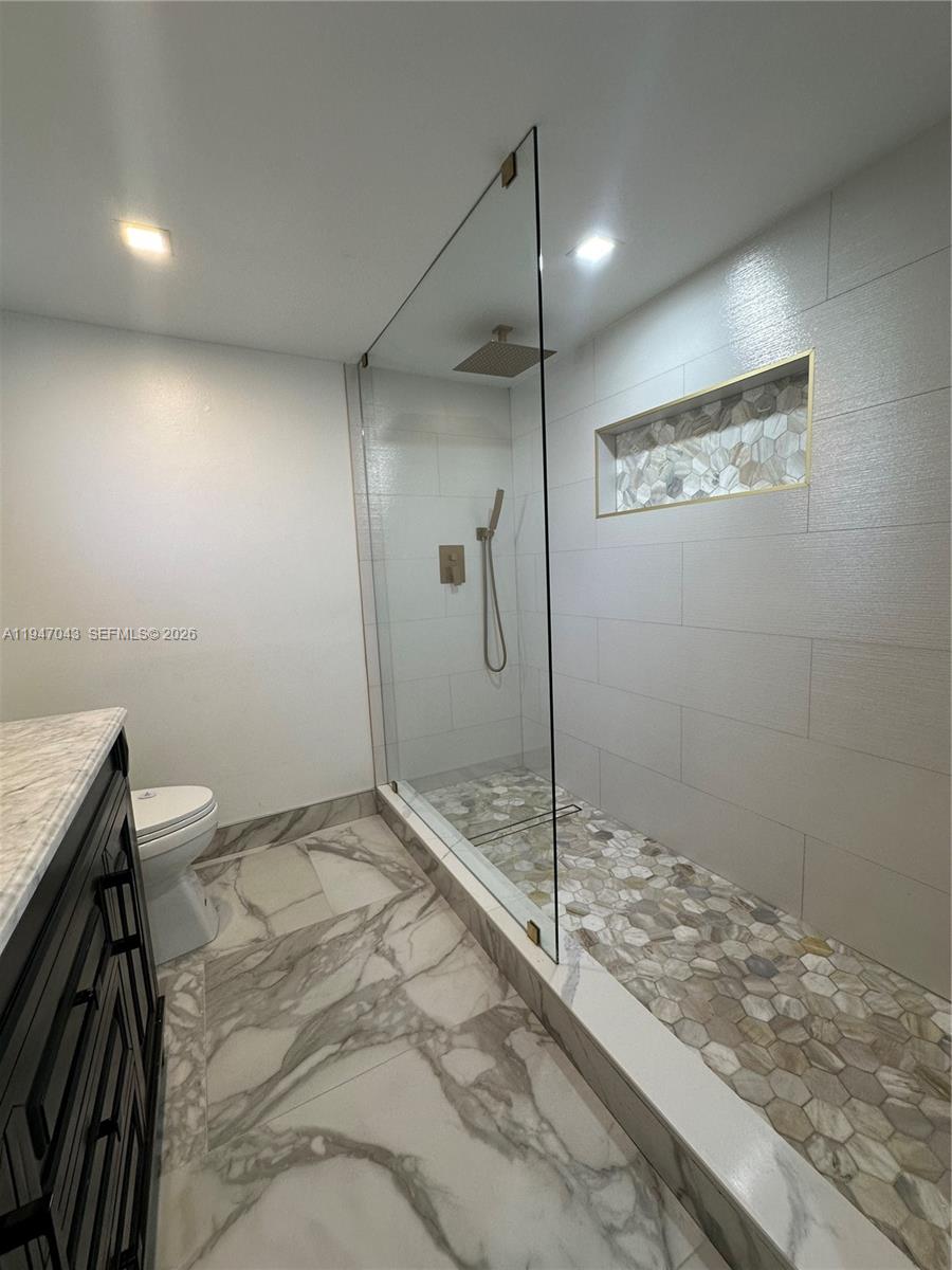 4100 North 58th Avenue, Unit 211 Hollywood, FL 33021 - Photo 36 of 47 a bathroom with a shower and a sink