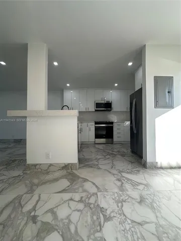a view of a kitchen with a sink