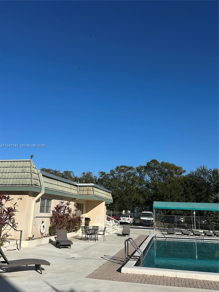 4100 North 58th Avenue, Unit 211 Hollywood, FL 33021 - Photo 41 of 47 a view of house with outdoor space and seating area