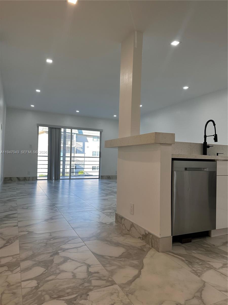 4100 North 58th Avenue, Unit 211 Hollywood, FL 33021 - Photo 8 of 47 a view of a kitchen with a sink and a stove top oven