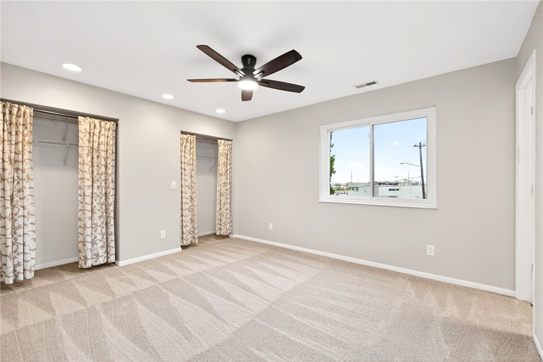 3151 Roesch Boulevard, Unit 6 Fairfield, OH 45014 - Photo 18 of 29 This spacious bedroom offers ample natural light and a comfortable atmosphere for rest and relaxation.