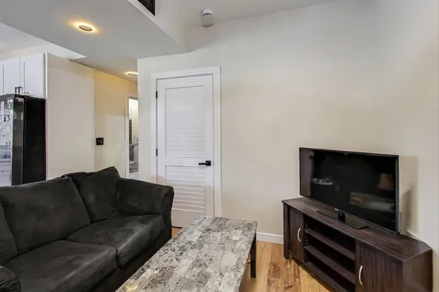 a bedroom with a bed and a dresser