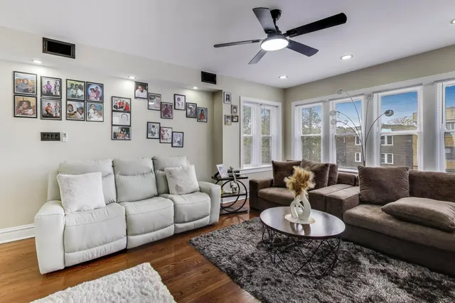 a living room with fireplace furniture and a flat screen tv