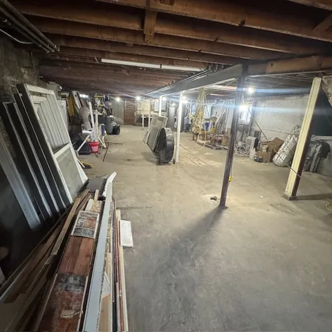 a view of a garage with a bike and car