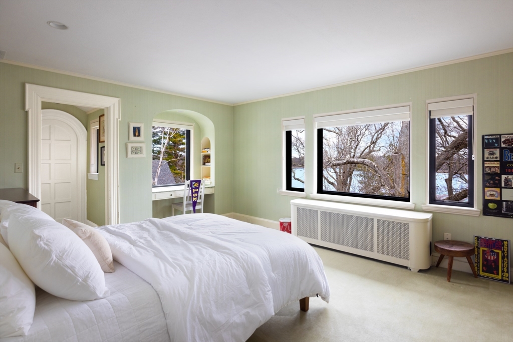 116 Chestnut Hill Road Newton, MA 02467 - Photo 13 of 18 a spacious bedroom with a bed and a large window