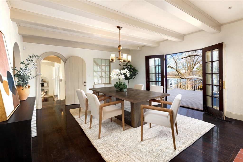 116 Chestnut Hill Road Newton, MA 02467 - Photo 3 of 18 a dining room with wooden floor a chandelier a wooden table and chairs