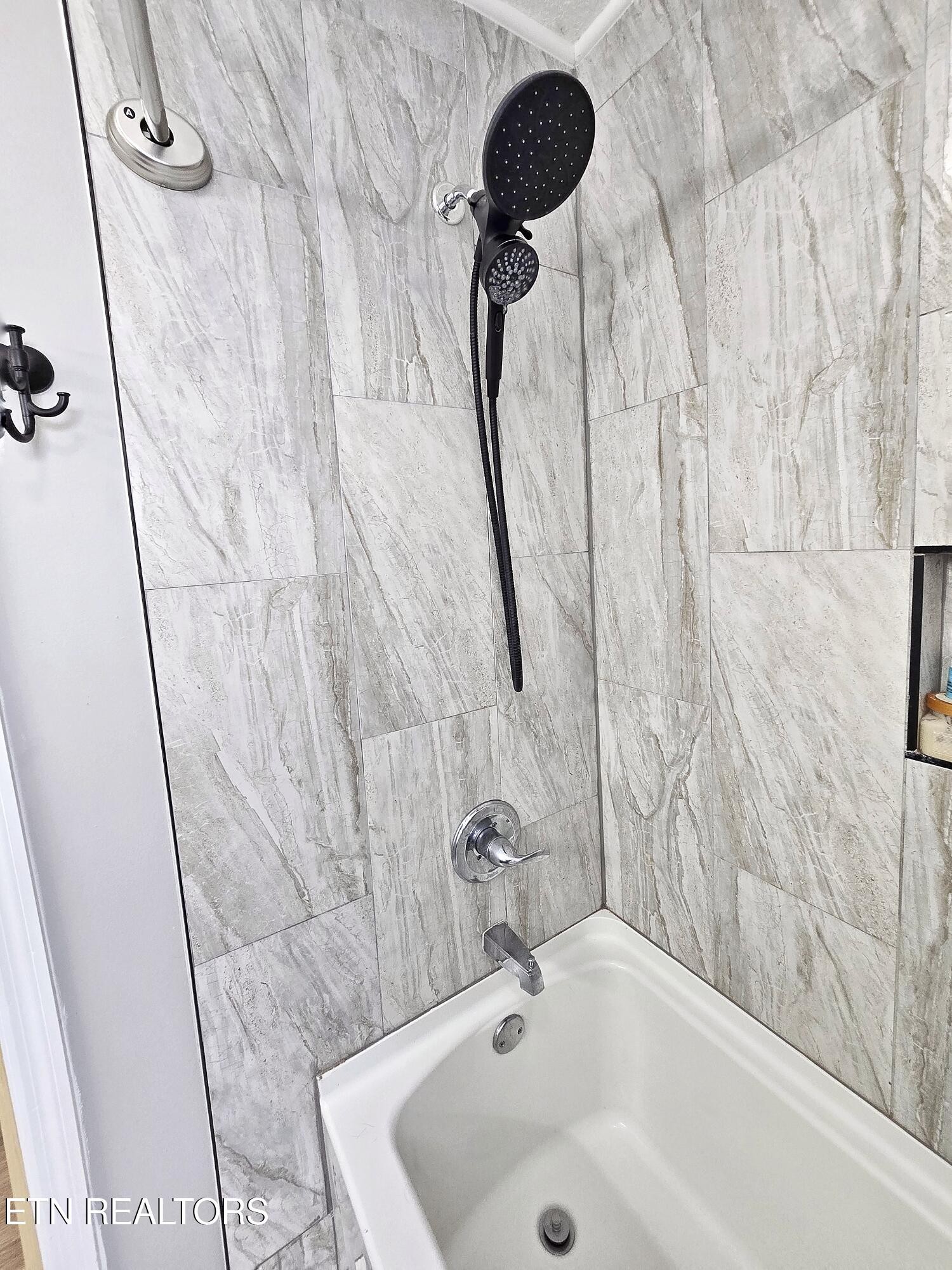 181 Sunset Road Clinton, TN 37716 - Photo 16 of 42 a bathroom with a sink and a tub