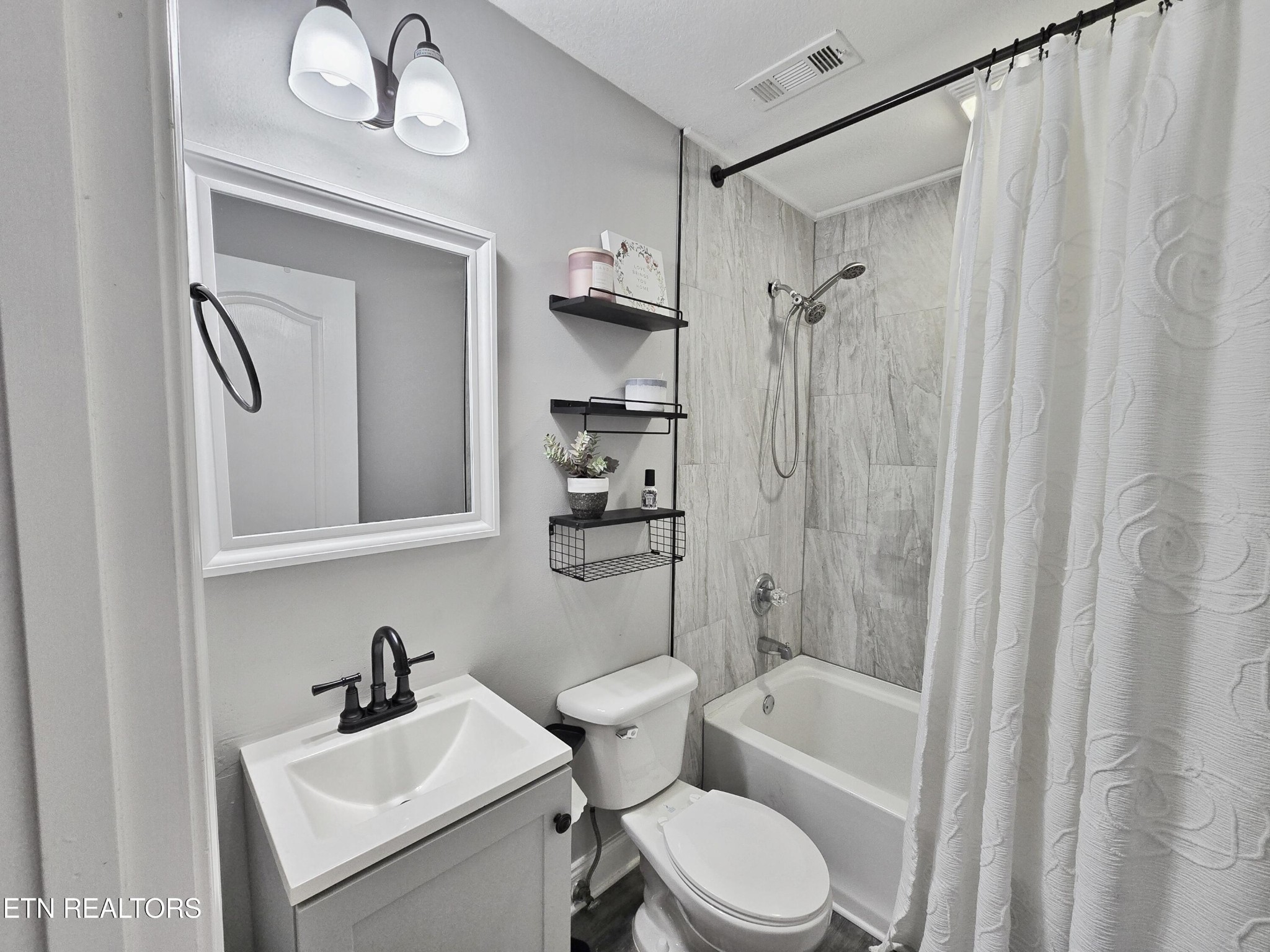 181 Sunset Road Clinton, TN 37716 - Photo 19 of 42 a bathroom with a sink toilet and shower