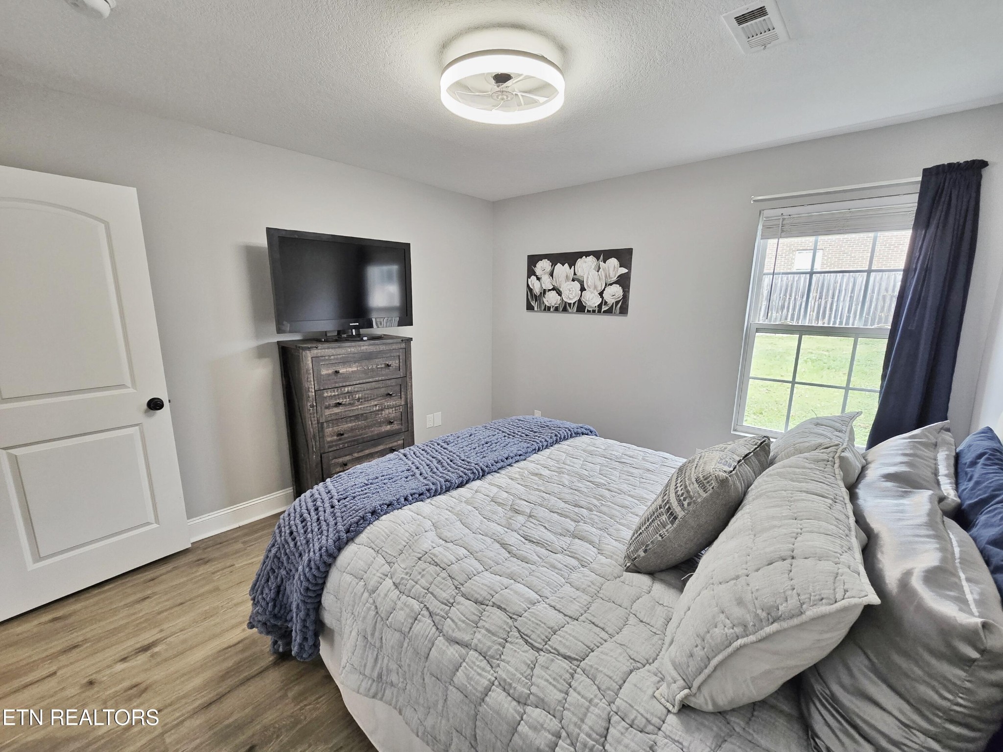 181 Sunset Road Clinton, TN 37716 - Photo 24 of 42 a bedroom with a bed and a television