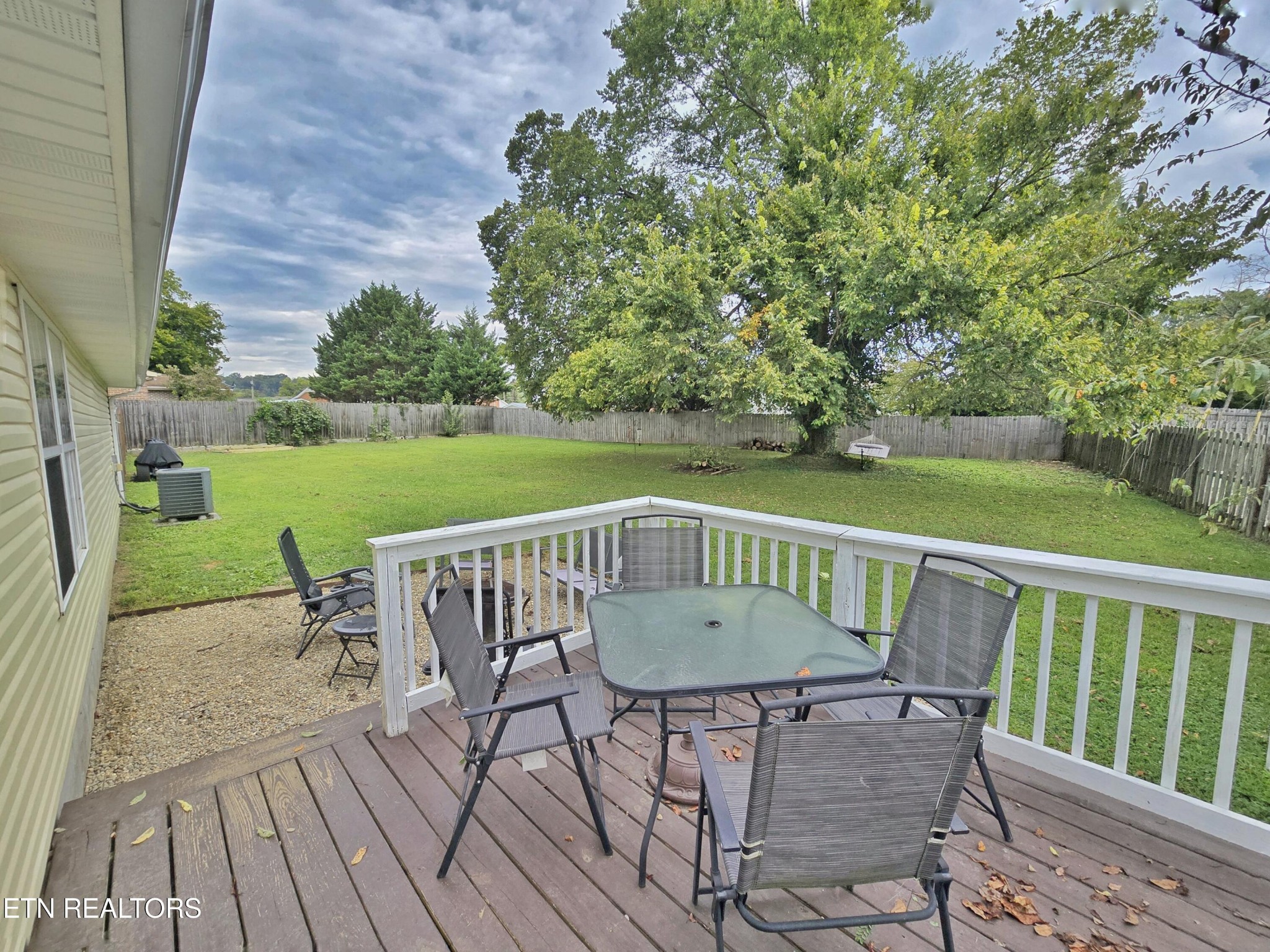 181 Sunset Road Clinton, TN 37716 - Photo 32 of 42 a view of a wooden deck with furniture