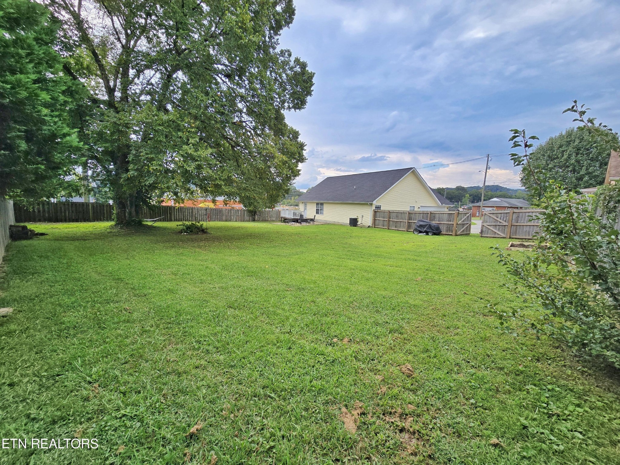 181 Sunset Road Clinton, TN 37716 - Photo 35 of 42 a view of a house with a yard
