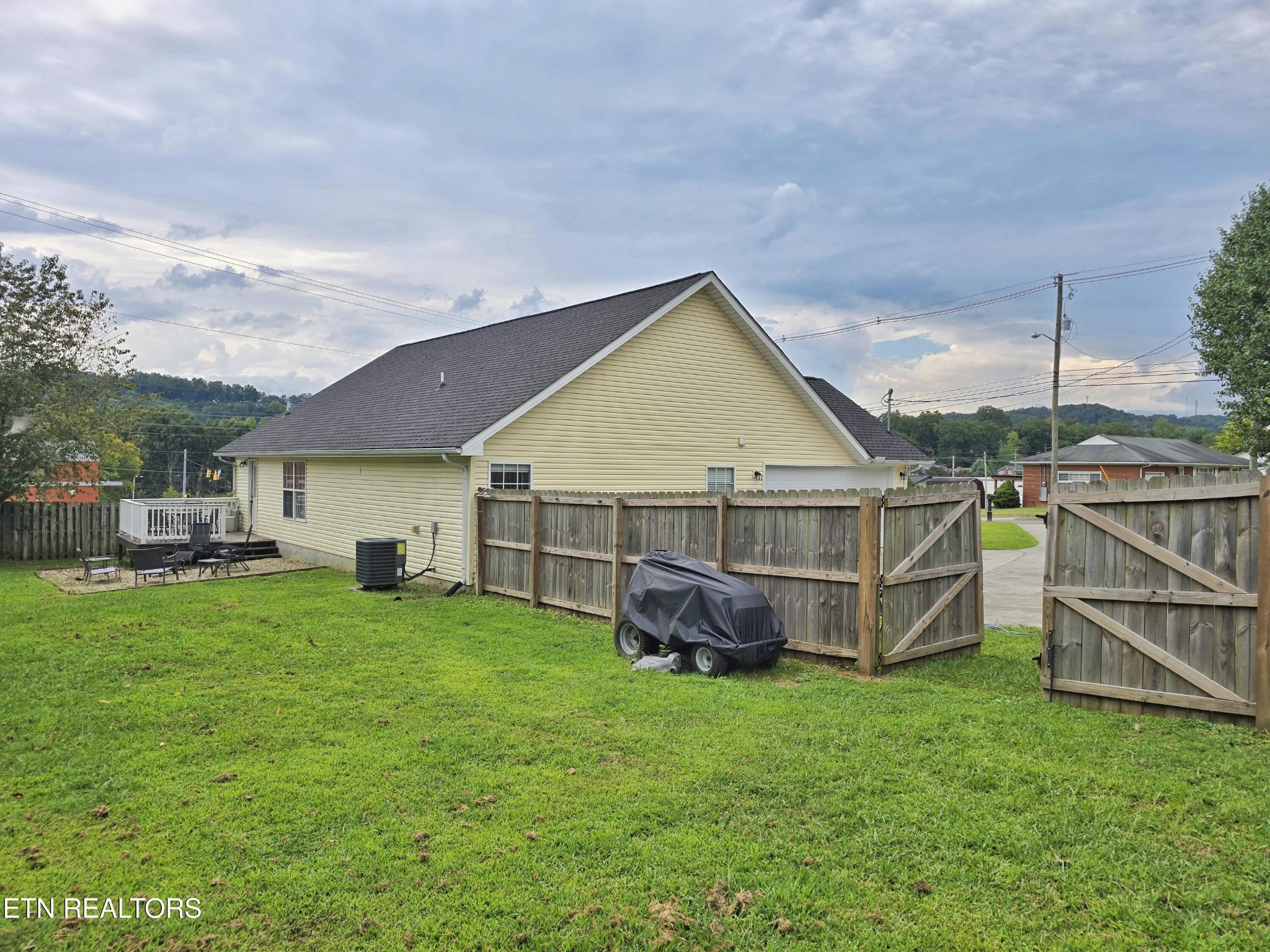 181 Sunset Road Clinton, TN 37716 - Photo 37 of 42 a view of a house with a yard and sitting area