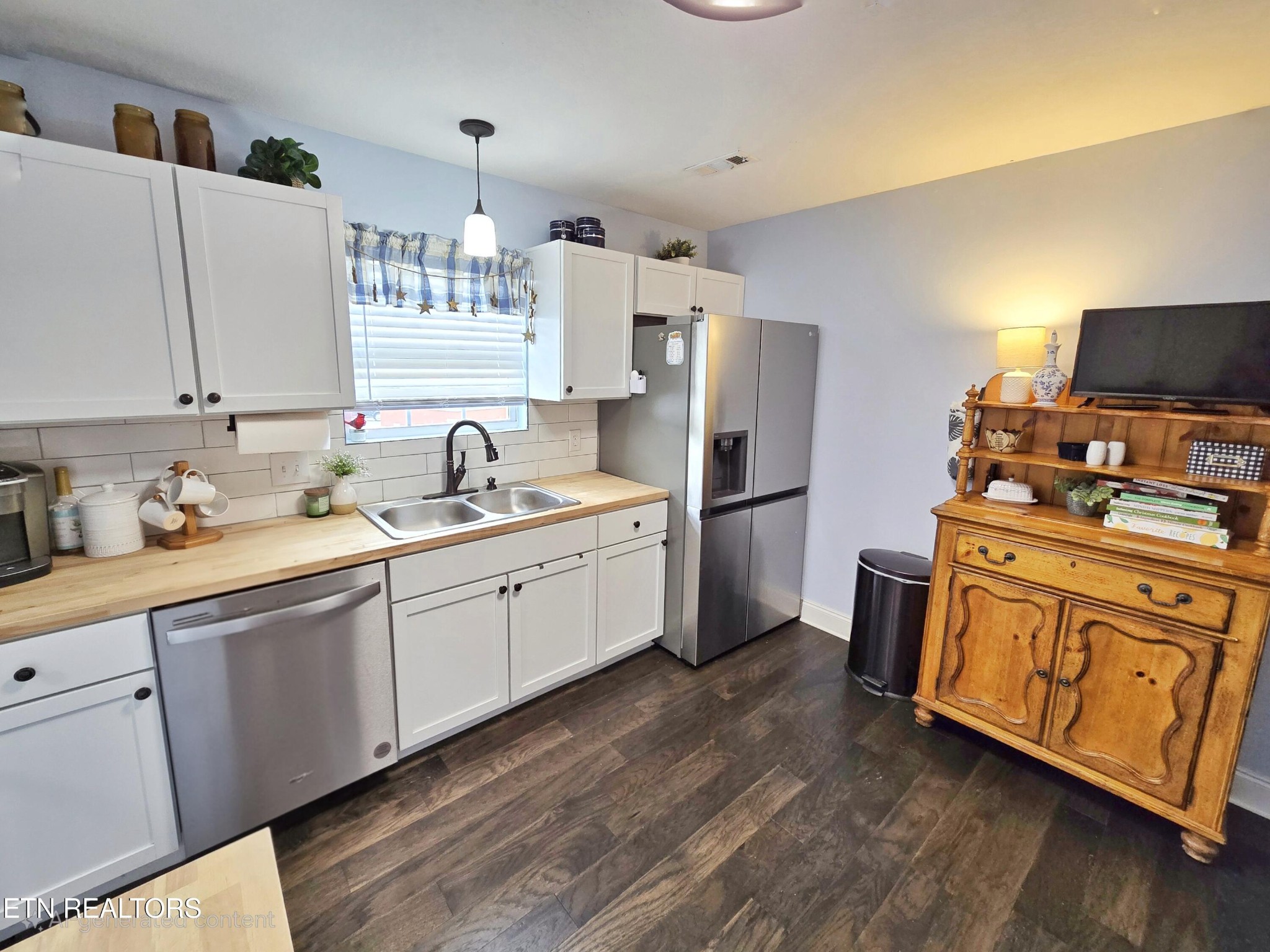 181 Sunset Road Clinton, TN 37716 - Photo 7 of 42 a kitchen with stainless steel appliances granite countertop a sink dishwasher a refrigerator and white cabinets with wooden floor