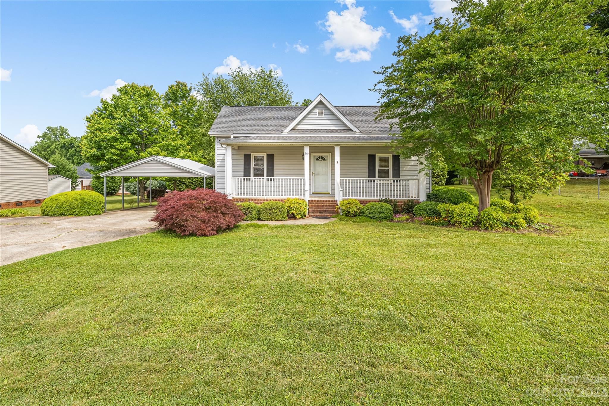 240 Nixon Road Belmont, NC 28012 - Photo 1 of 21 a front view of a house with garden