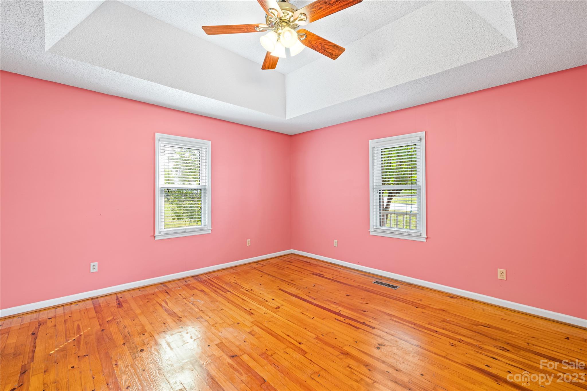240 Nixon Road Belmont, NC 28012 - Photo 12 of 21 en empty room with a window and a ceiling fan