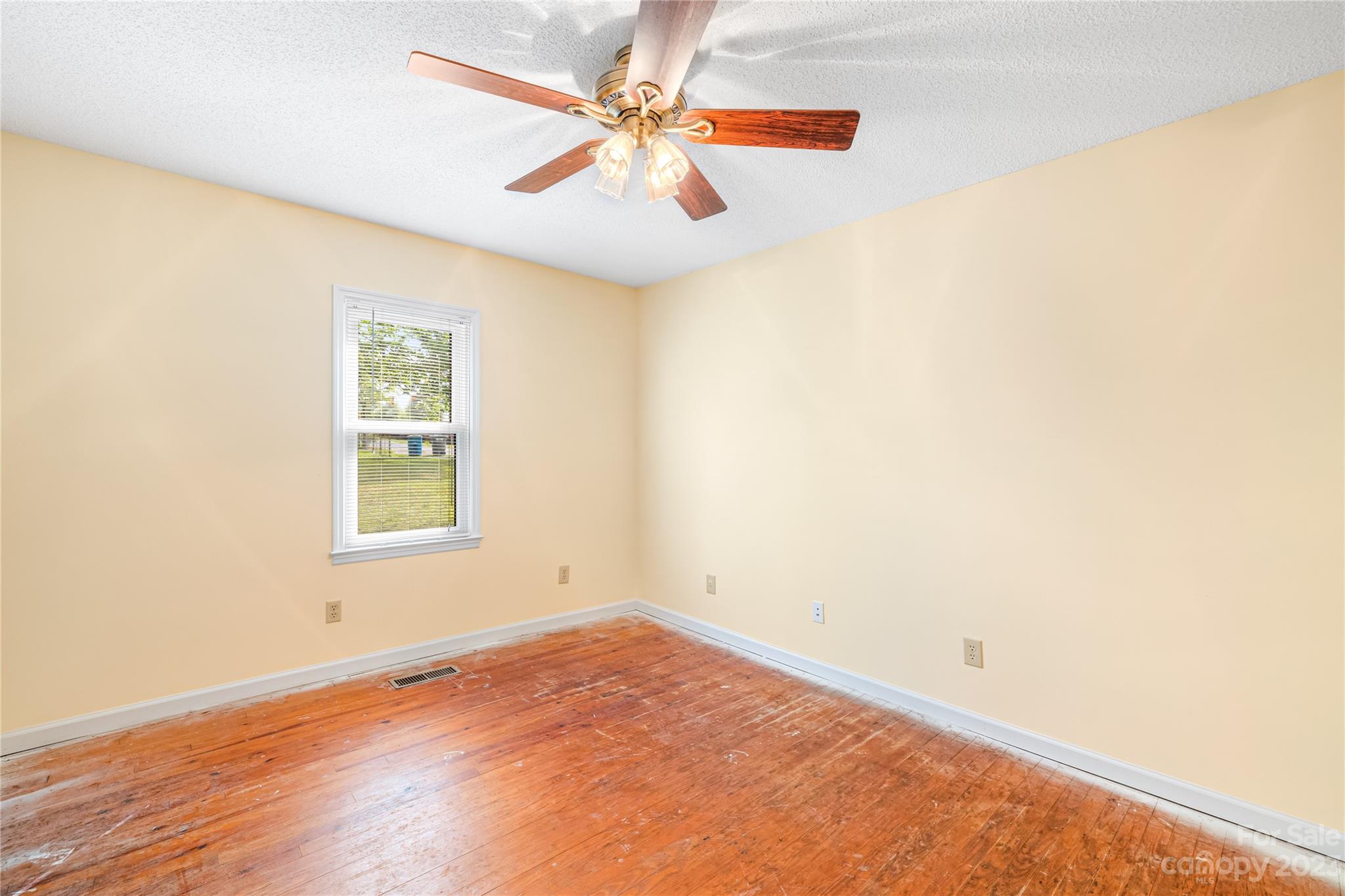 240 Nixon Road Belmont, NC 28012 - Photo 14 of 21 an empty room with a window and a fan