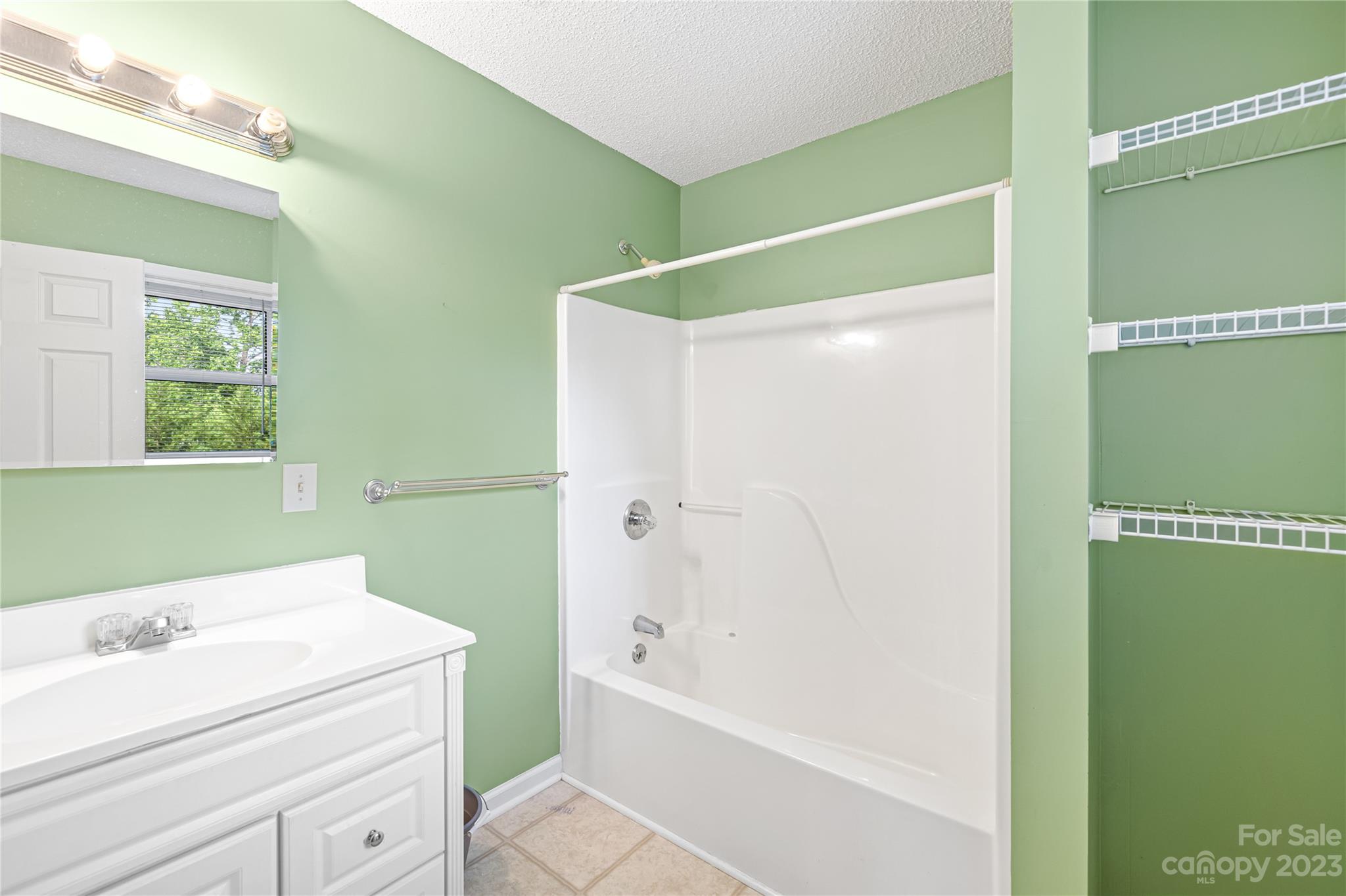 240 Nixon Road Belmont, NC 28012 - Photo 17 of 21 a bathroom with a bathtub and a shower