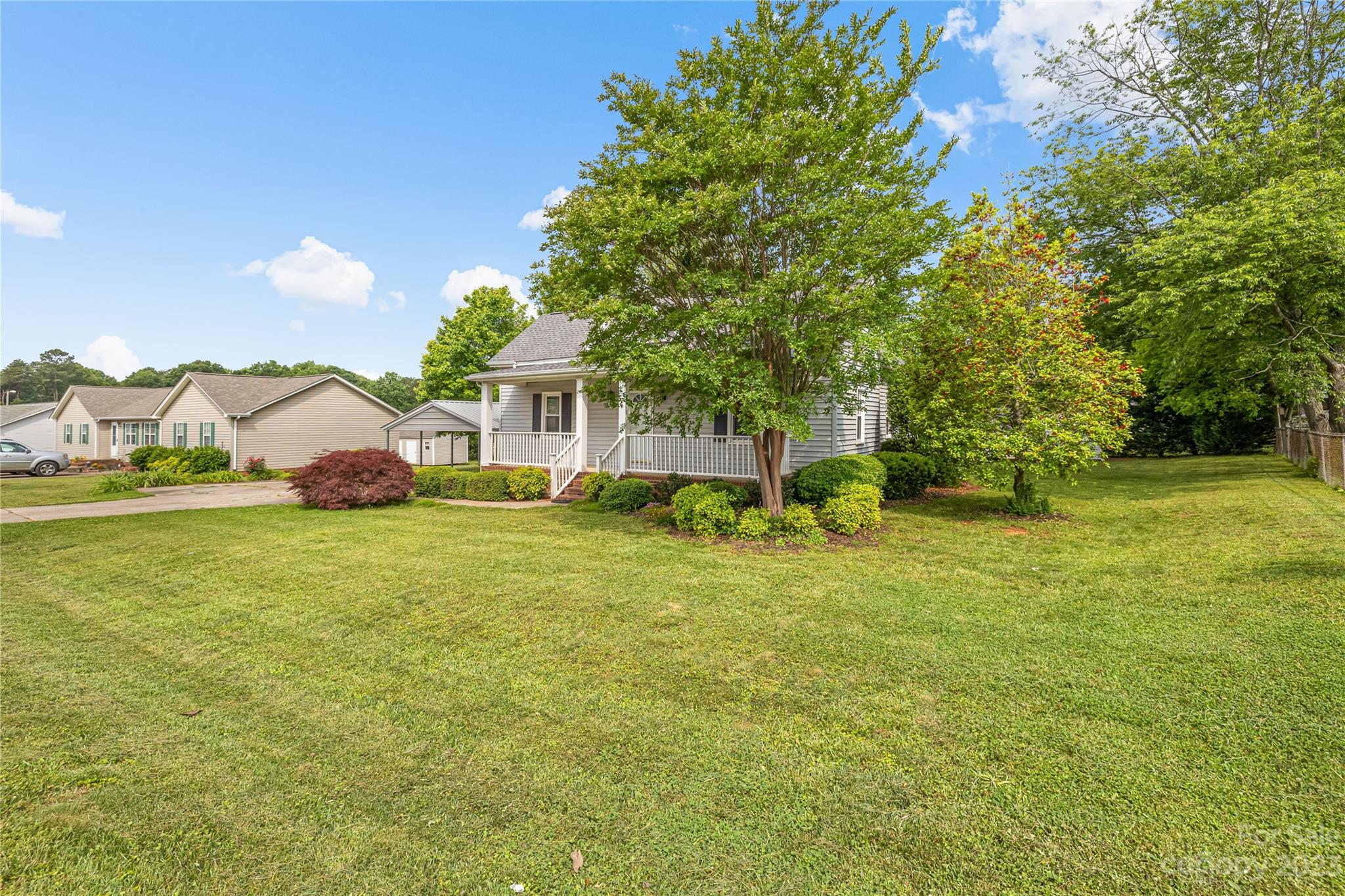 240 Nixon Road Belmont, NC 28012 - Photo 3 of 21 a view of a house with a big yard and large trees