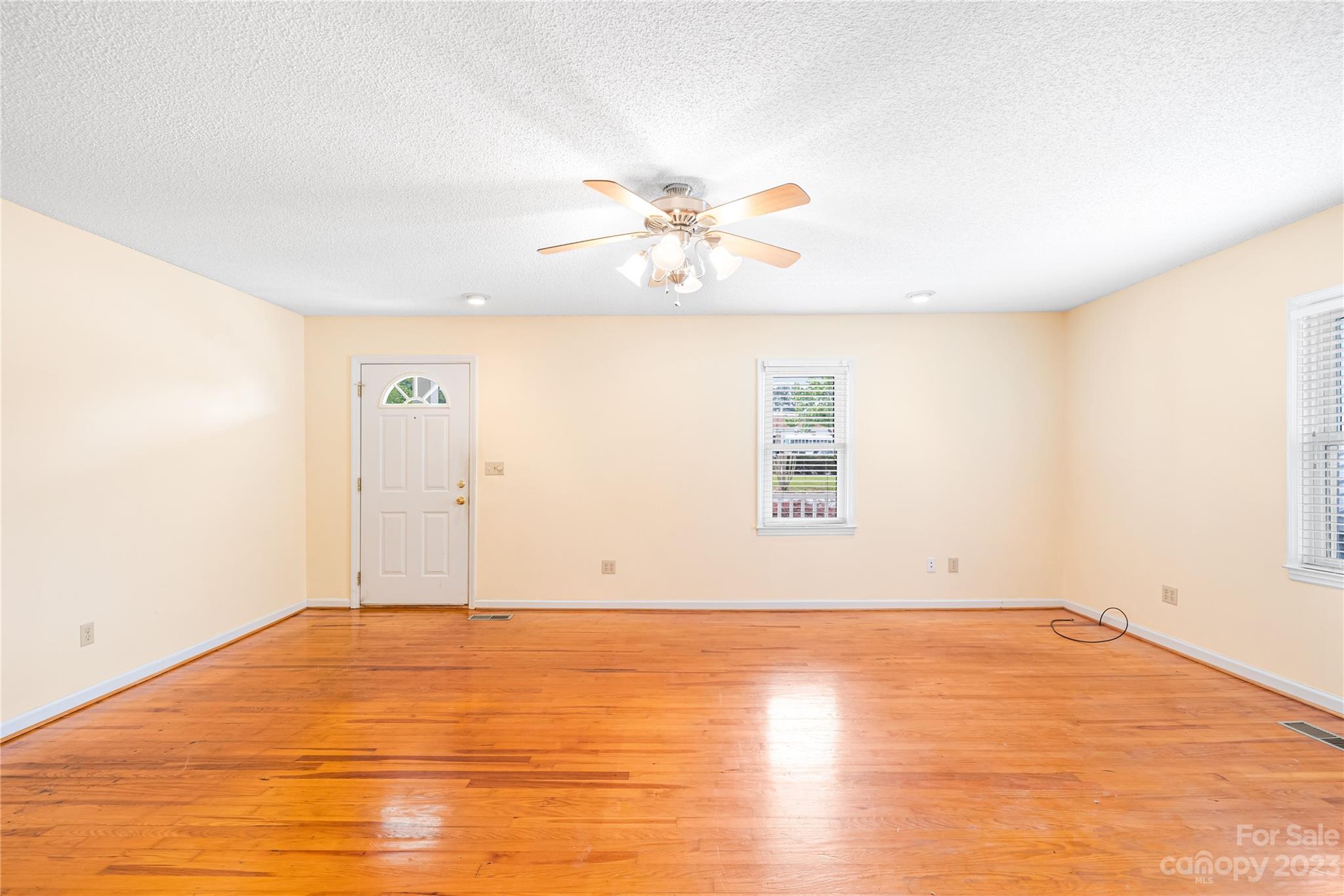 240 Nixon Road Belmont, NC 28012 - Photo 7 of 21 an empty room with cabinet and a ceiling fan