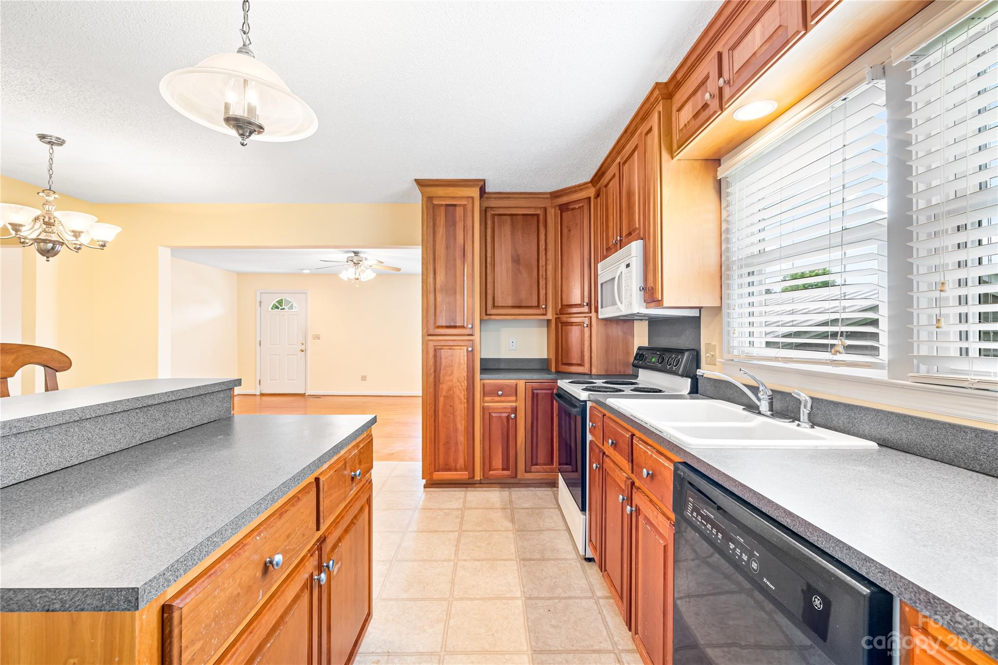 240 Nixon Road Belmont, NC 28012 - Photo 8 of 21 a kitchen with stainless steel appliances a sink stove and a window