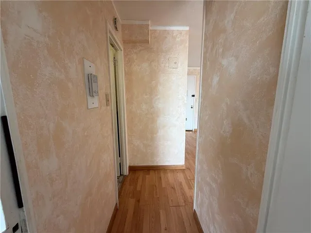 a view of a bathroom from a hallway