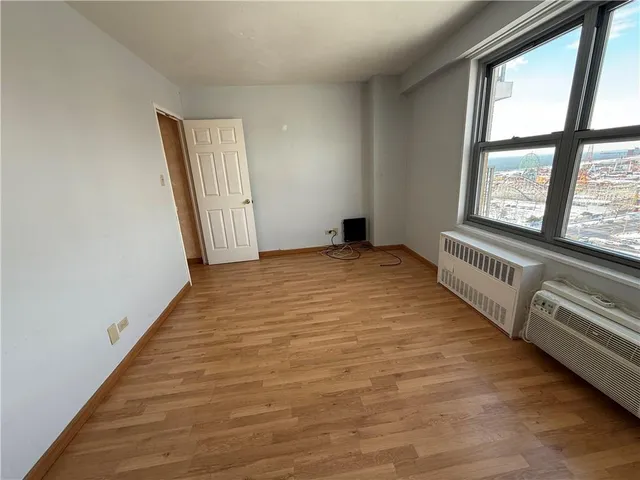 a view of an empty room with a window