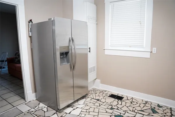 a bathroom with a glass shower door